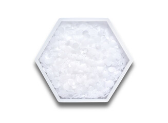 Polyethylene in hexagonal molecular shaped container on white background.
