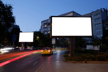 Blank billboard in the city traffic,copy space.Advertisement