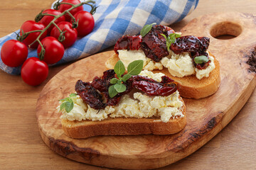 Bruschetta with soft cheese and tomato