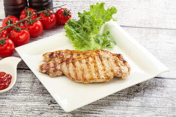 Grilled pork steak with ketchup