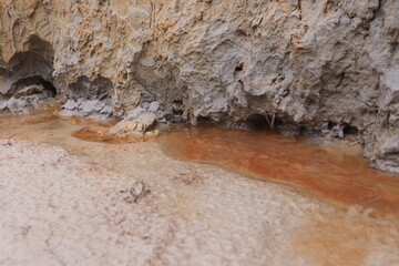 small stream of water on the edge of the cliff