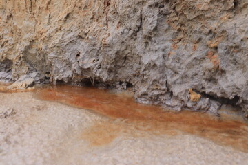 small stream of water on the edge of the cliff