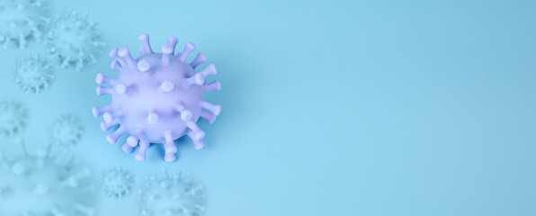 Covid-19 virus cells on blue background for concept, sick, health care, disease treatment and prevention.