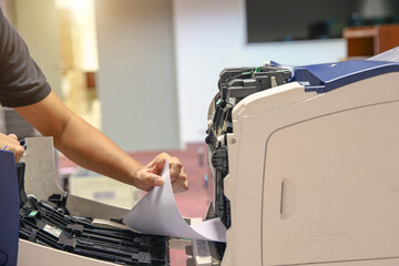 Technician hand open cover photocopier or photocopy to fix paper jam and replace ink cartridges for...