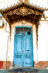 wooden entrance doors of old houses porch and front entrance. vintage architecture and restoration