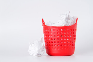 Trash can. Full basket. Crumpled paper in a basket.