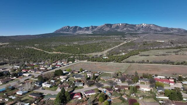 Aerial Monticello Utah rural neighborhood. Settled in July 1887 by pioneers from The Church of Jesus Christ of Latter-day Saints. Farming, ranching, and uranium mining. Mountain valley.