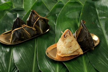 Kue Cang or Ki Jang and Zongzi or Bakcang. Chinese Savoury Sticky Rice Dumplings - obrazy, fototapety, plakaty