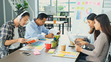 Group of asian creative people working at office, Business team meeting to plan the project, creative office lifestyle
