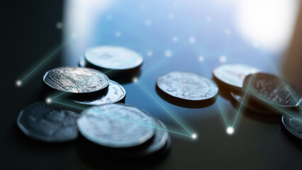 Blur coin on black wooden with overlight background. plan income investment cash money for 2023 new year. business or finance concept.