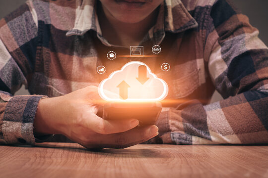 Man using phone to upload and back up cloud computing in hand cloud technology data storage.