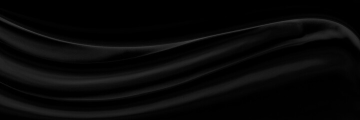 Black gray satin dark fabric texture luxurious shiny that is abstract silk cloth background with patterns soft waves blur beautiful.