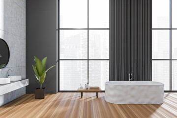 Stylish bathroom interior with tub and sink, accessories and panoramic window