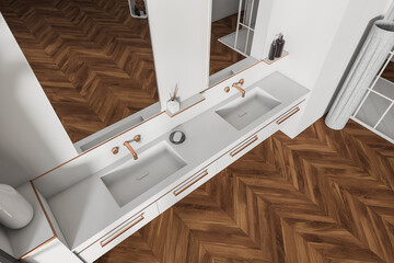Top view of bathroom interior with sink and two mirrors, wooden floor