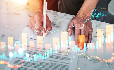 Businesswoman sign a business contract, stock market hud