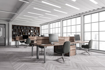 Office interior with computer on desk, panoramic window on city view