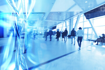 blue background blurred movement of people shopping mall