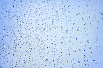 drops glass blue background abstract, transparent cold background water splashes