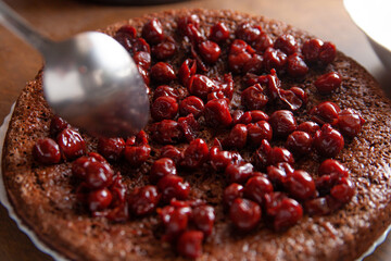 brown cake with red berry