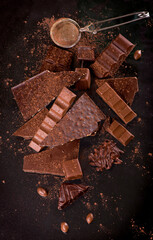 dark chocolate over wooden background, selective focus