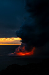 Dusk glowing molten lava flowing from nearby Kilauea
