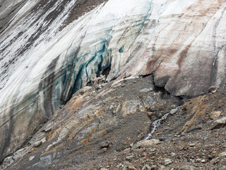 Melting glacier texture. Minimalist nature background of glacier surface with big cave and cracks....