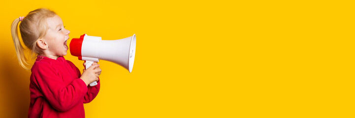 child girl shouts into a white megaphone on a bright yellow background. Banner