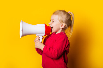 child screaming megaphone looks up on bright yellow background