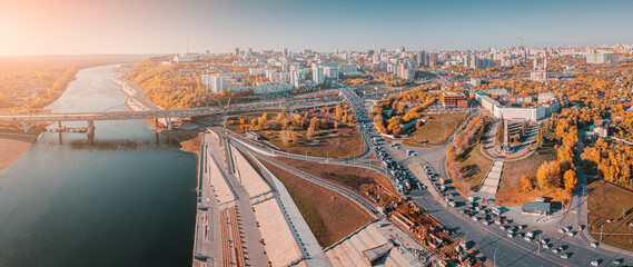 Traffic and transport in the city. Panoramic aerial view of crossroads and streets passing over the...