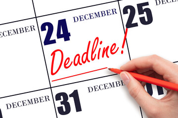 24th day of December. Hand drawing red line and writing the text Deadline on calendar date December...