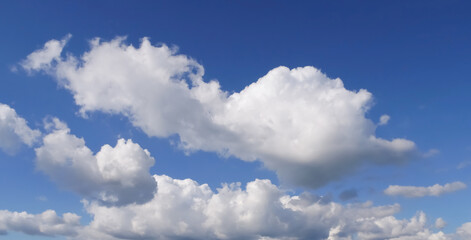 Big clouds over navy-blue skies