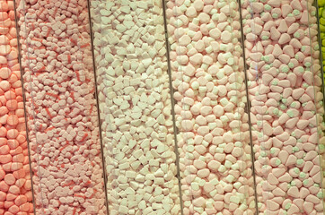 sweets of different shapes and different colors in large quantities