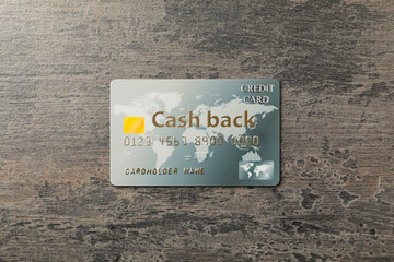 Cashback credit card on grey table, top view