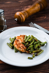 fried chicken with asparagus close up
