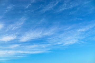 bright blue sky with clouds as abstract background