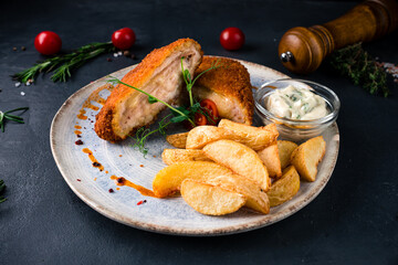 Crispy deep fried home made chicken Cordon bleu with cheese and ham and french fries