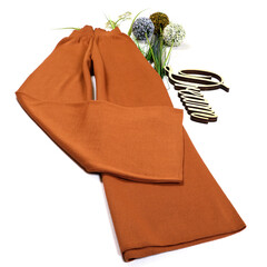 Close-up. Stylish female image. Woolen pants on a white background.