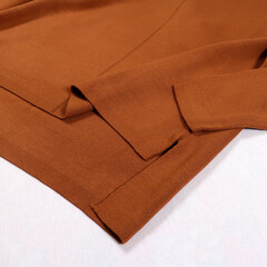 Close-up. Stylish female image. Woolen pants on a white background.