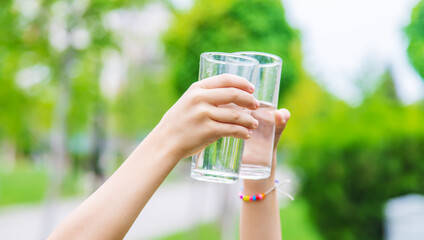 children drink clean water in nature.selective focus