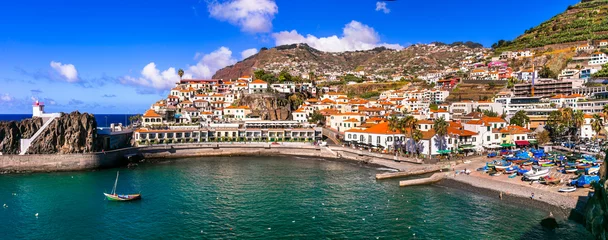 Poster Charming traditional fishing village Camara de Lobos. Popular tourist destination .Madeira island travel and landmarks. Portugal © Freesurf