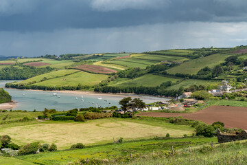 View from the South West Coastal Path near Thurlestone towards Buckland village in Devon - obrazy, fototapety, plakaty
