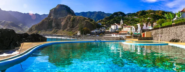 Fototapeten Scenic Madeira island, natural swimming pools of charming Porto da Cruz village. Popular tourist resort in Portugal © Freesurf