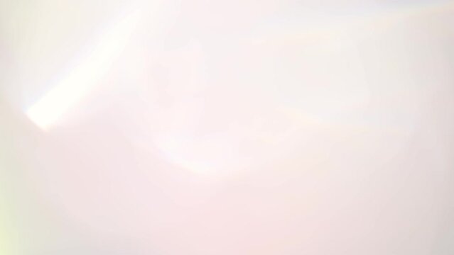 gentle light background, abstraction movement glare. light passes through the facets of a slowly rotating diamond and creates repetitive sparkling highlights