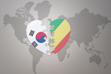 puzzle heart with the national flag of republic of the congo and south korea on a world map background. Concept.