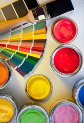 Painting and Decorating - Tins of color emulsion paint.