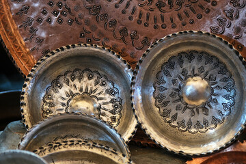 Traditional handmade patterned metal souvenir plates in Gaziantep, Turkey