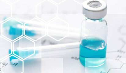 small jars with injection and syringe for injection on a blue background near the chemical formula