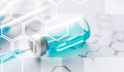 small jars with injection and syringe for injection on a blue background near the chemical formula