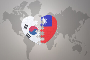 puzzle heart with the national flag of taiwan and south korea on a world map background. Concept.