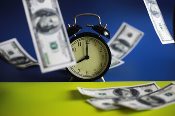 Green dollar bills on a blue background. 100 dollar bills close up. The concept of wealth and...